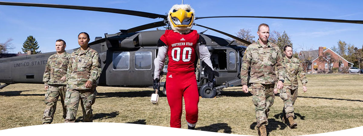 Thor the Thunderbird exiting a helicopter with ROTC personnel 